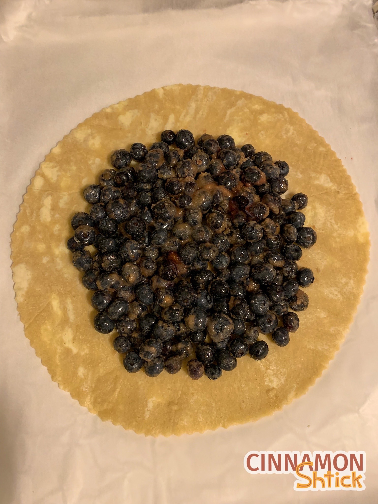 galette dough with blueberry filling in middle