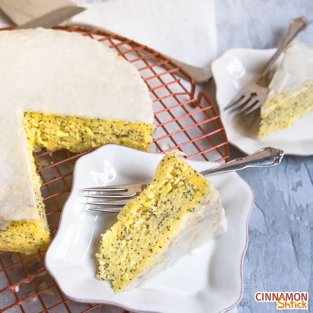 Slice of Lemon Poppyseed Stovetop Cake with cake behind it. 