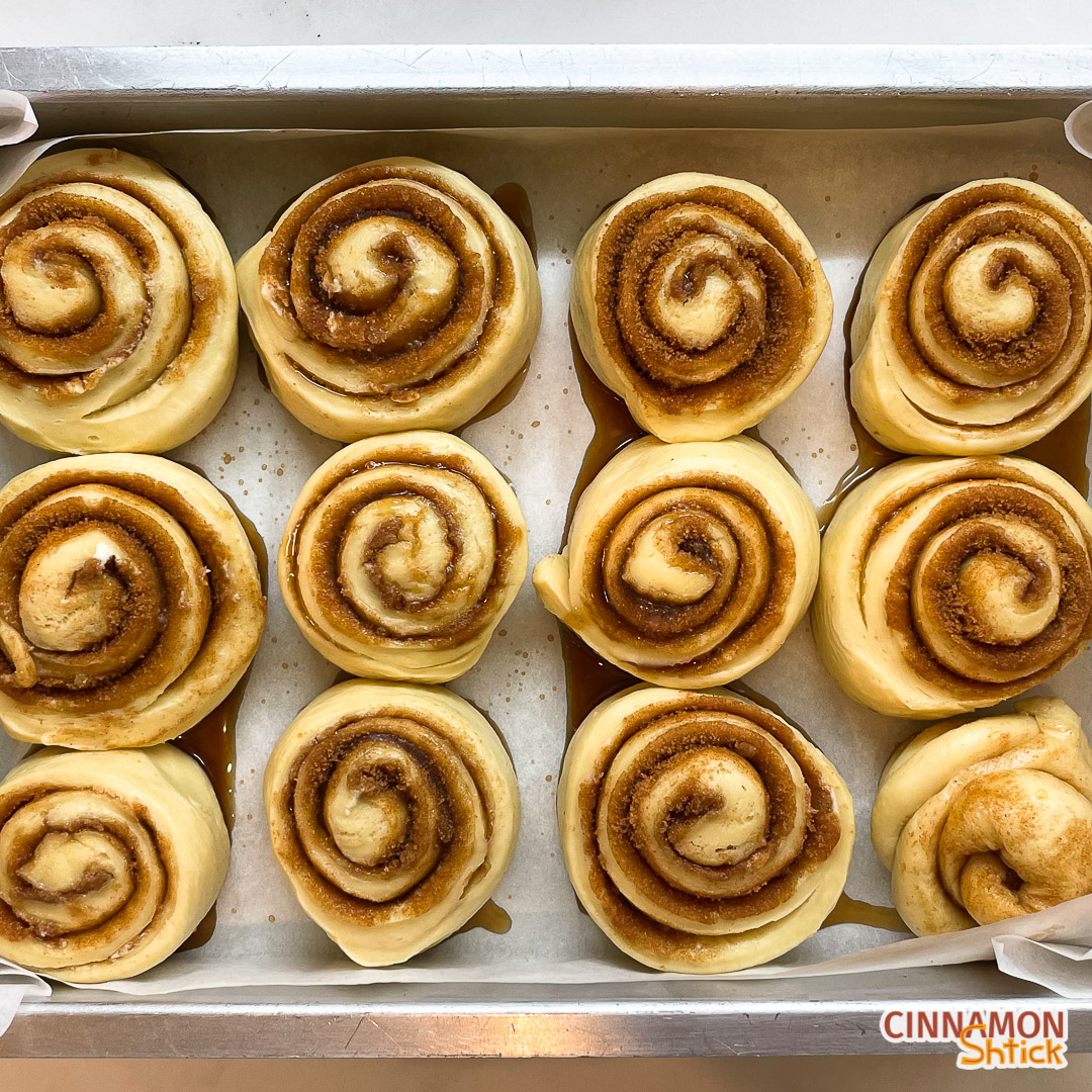 cinnamon rolls in pan after overnight rise