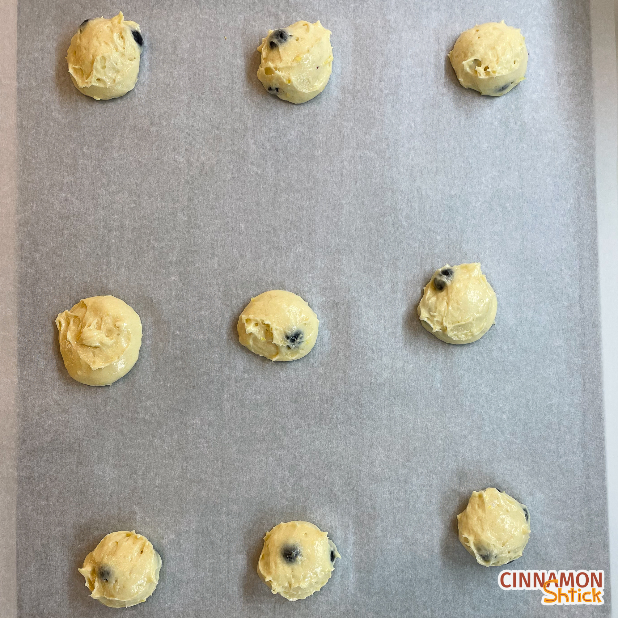 blemon halfsies cookie dough mounds on parchment lined baking sheet