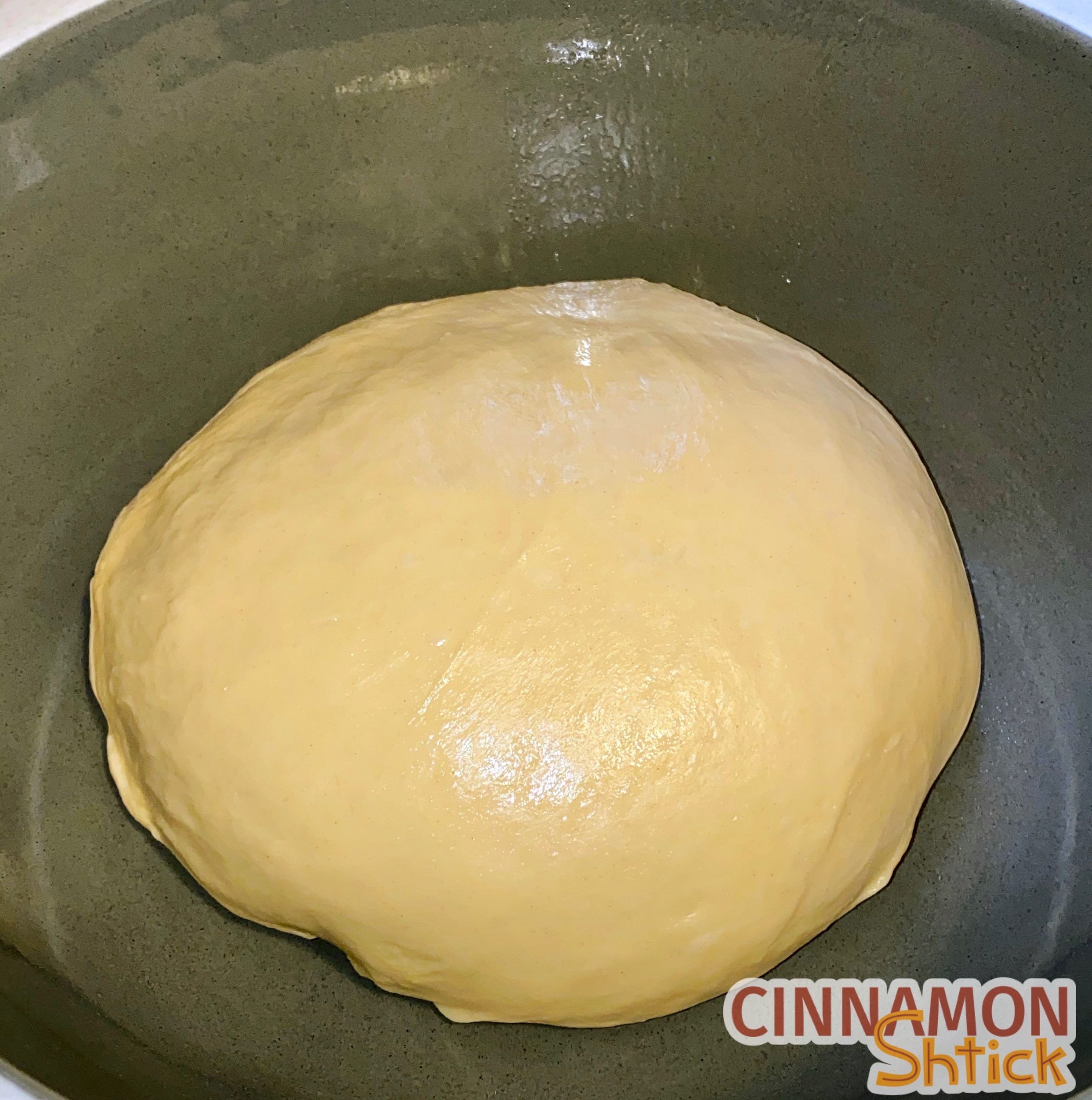 Ball of babka dough in bowl