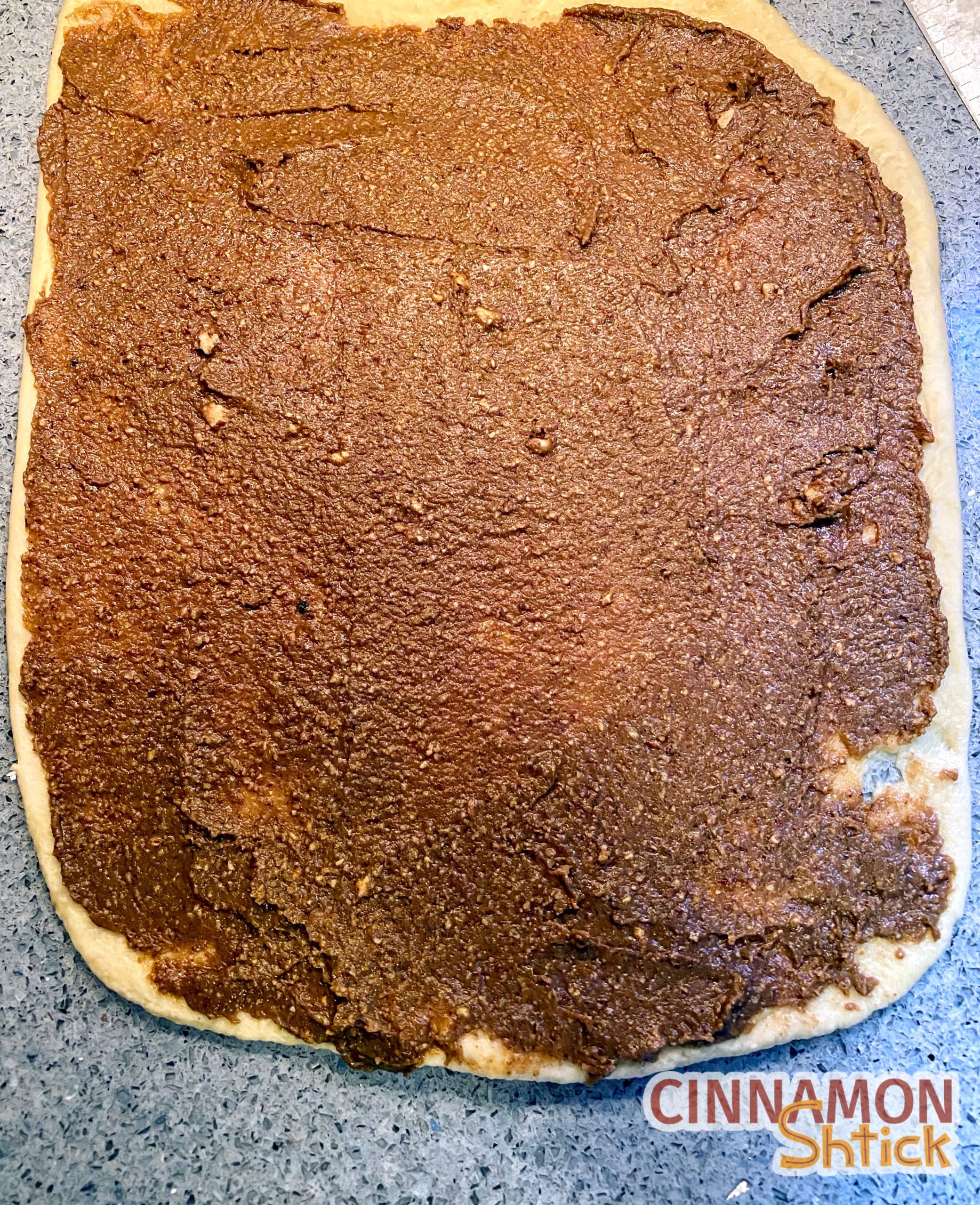 Babka dough rolled into a rectangle, covered with filling