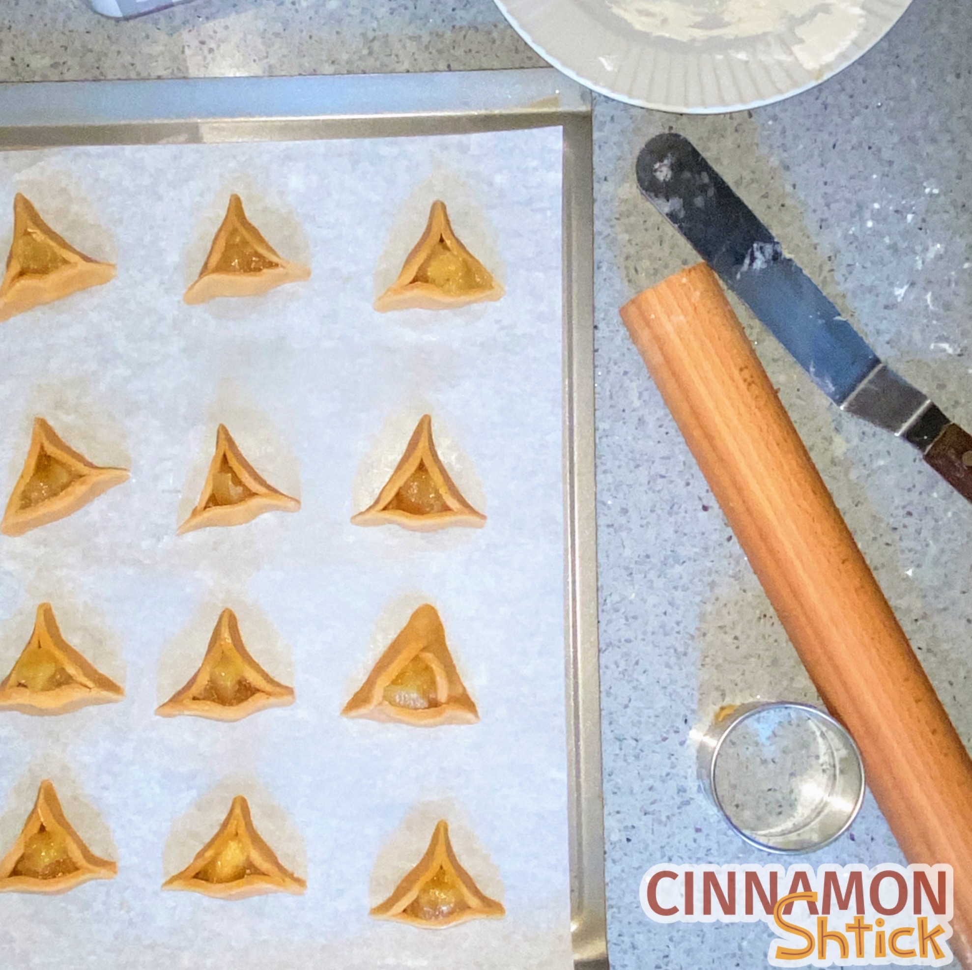 shaped hamentaschen on baking sheet