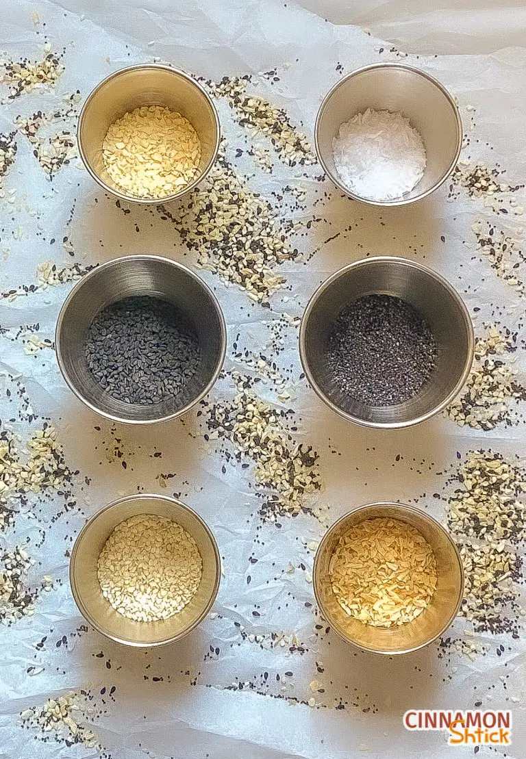 small cups holding 6 different spices for the everything seasoning blend