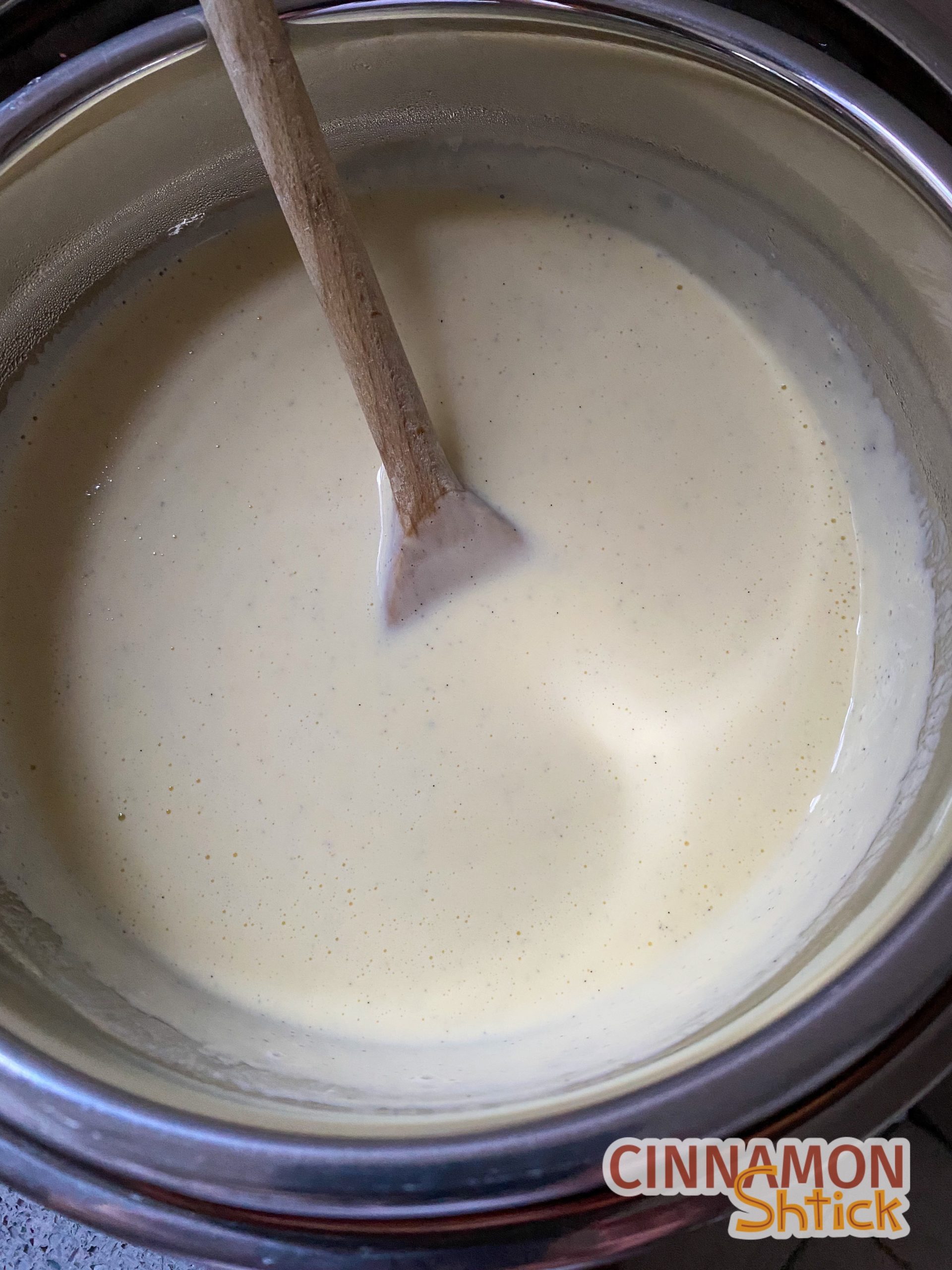 Ice cream base cooling in bowl over ice bath