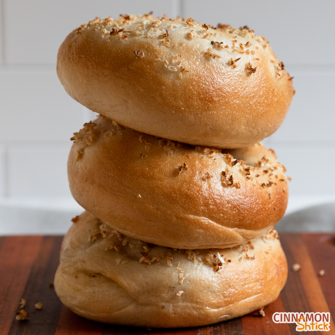 Three onion bagels stacked on each other