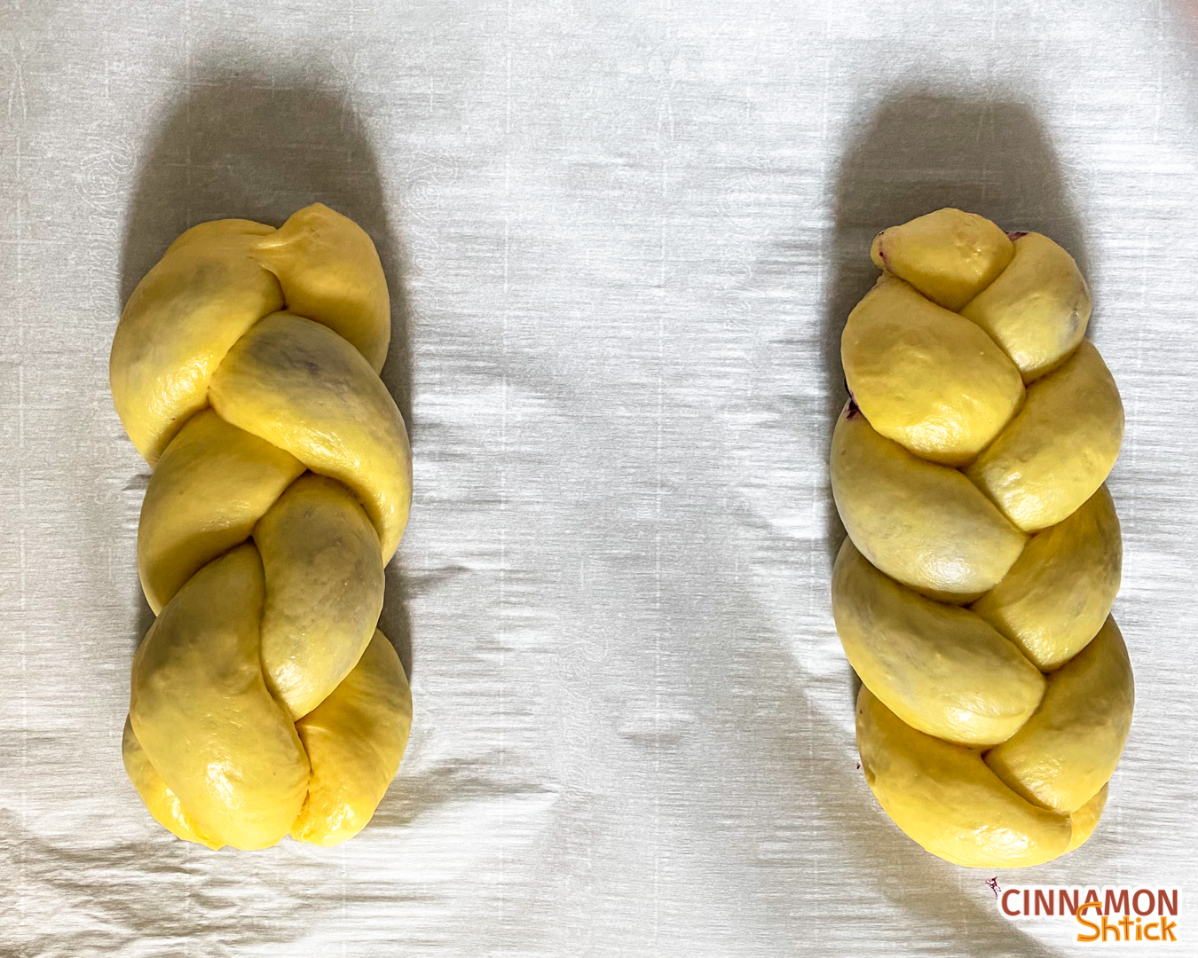 2 loaves of babkallah braided, each with 3 strands