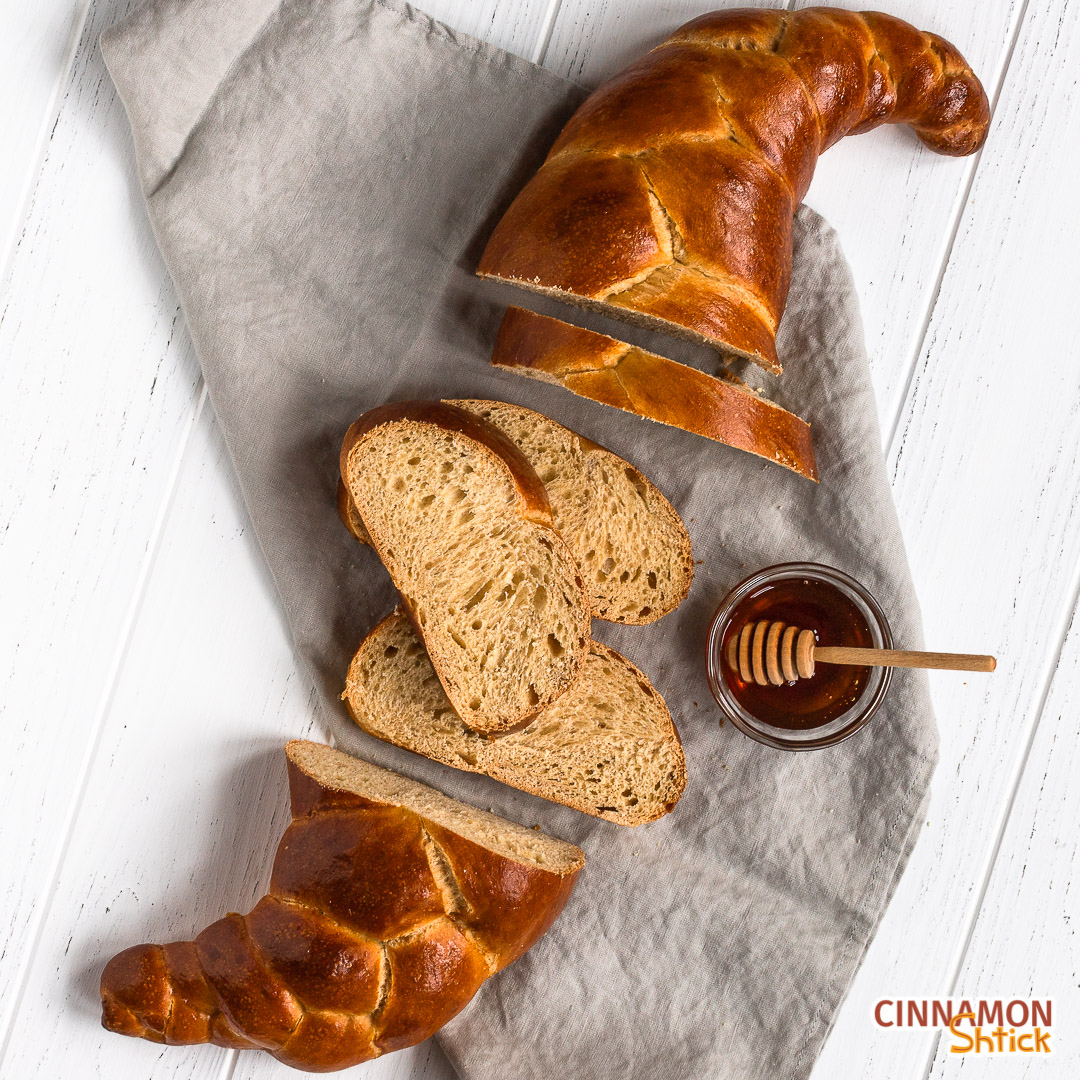 Sourdough challah sliced in the middle showing slices