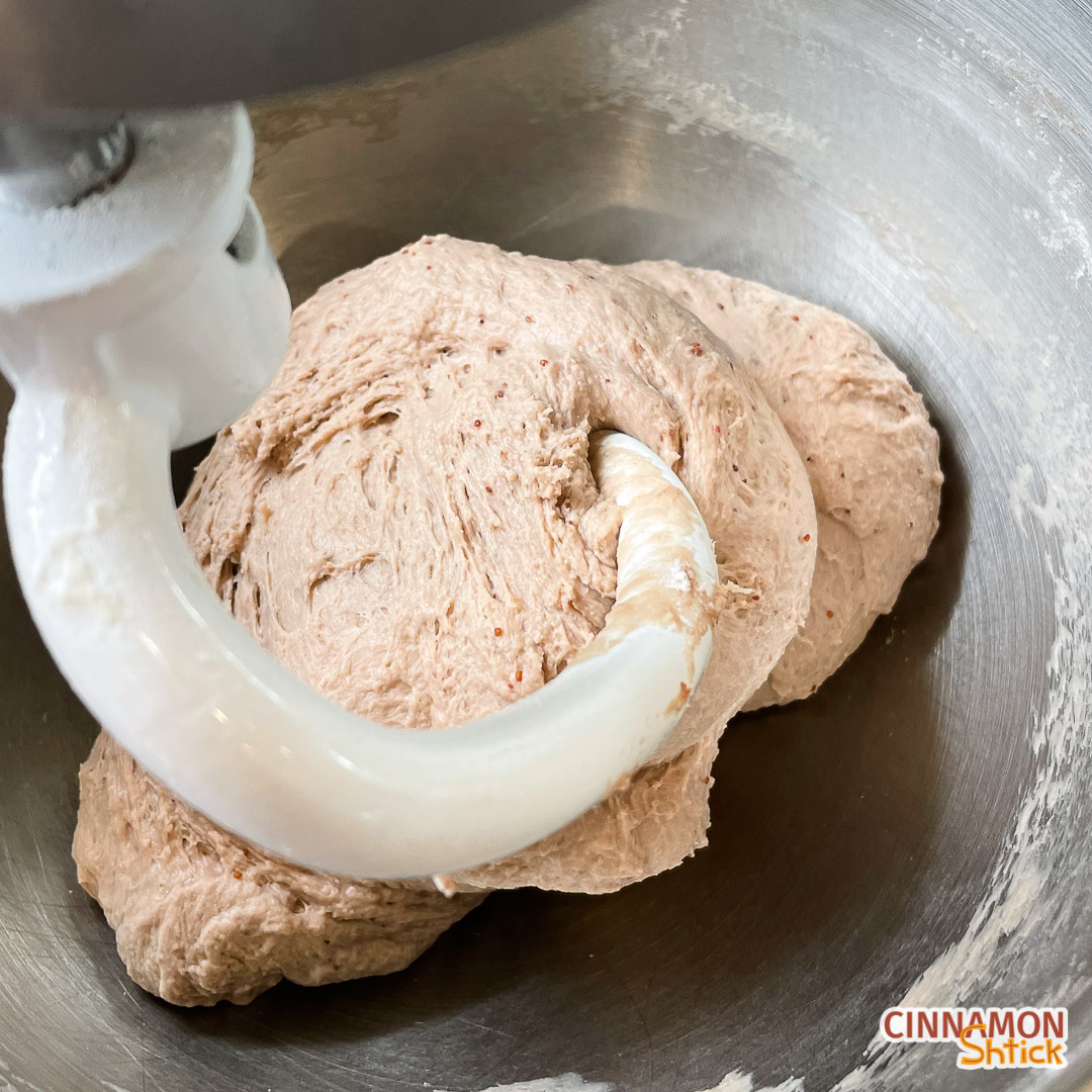 Dough in mixer showing that it cleans the bottom and sides of the mixing bowl.