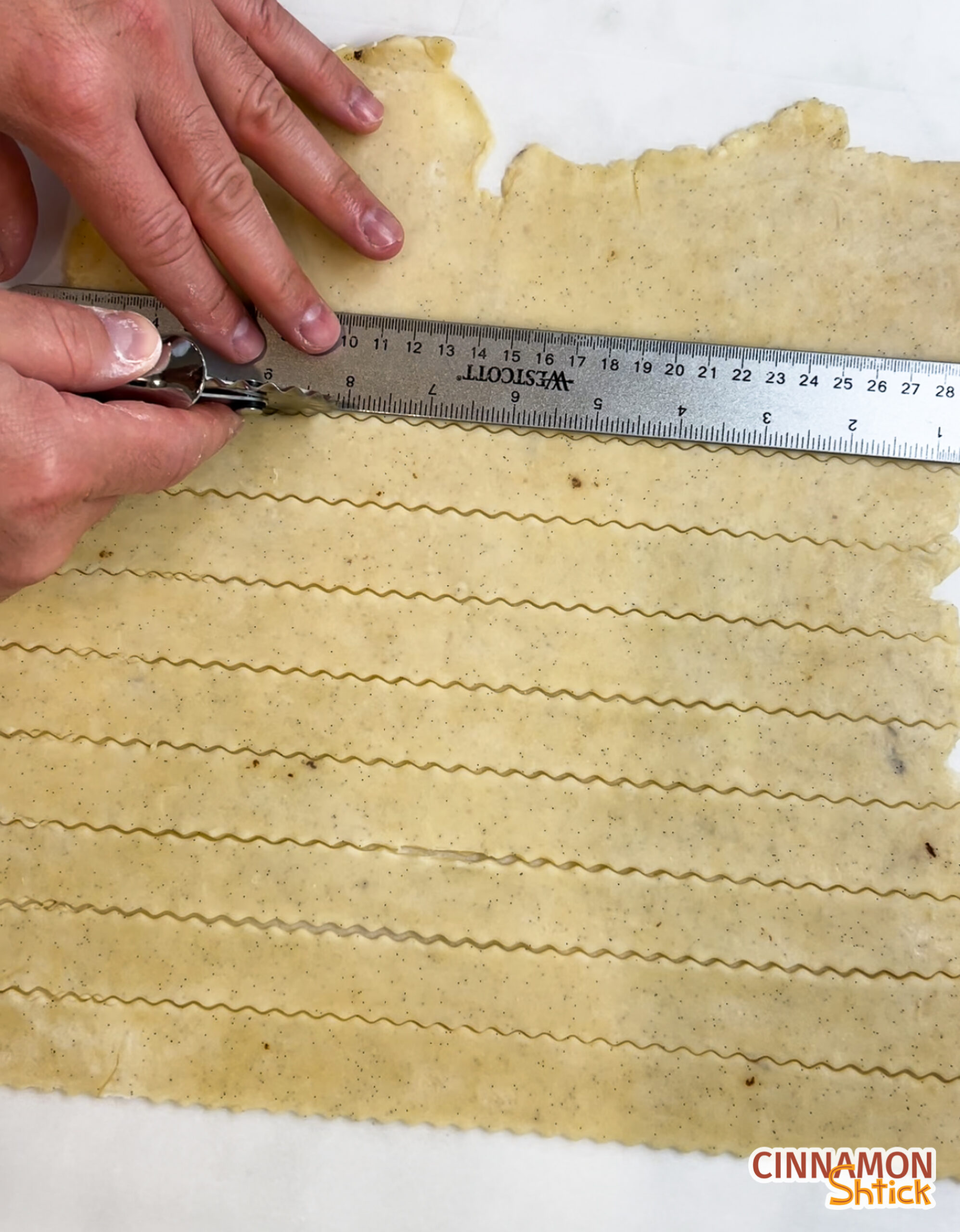 pie dough rolled out and sliced into strips for a lattice topping