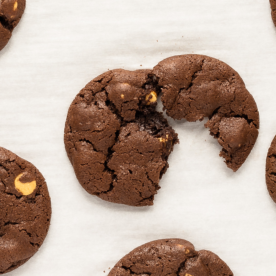 overhead shot of a chocolate peanut butter cookie pulled in half