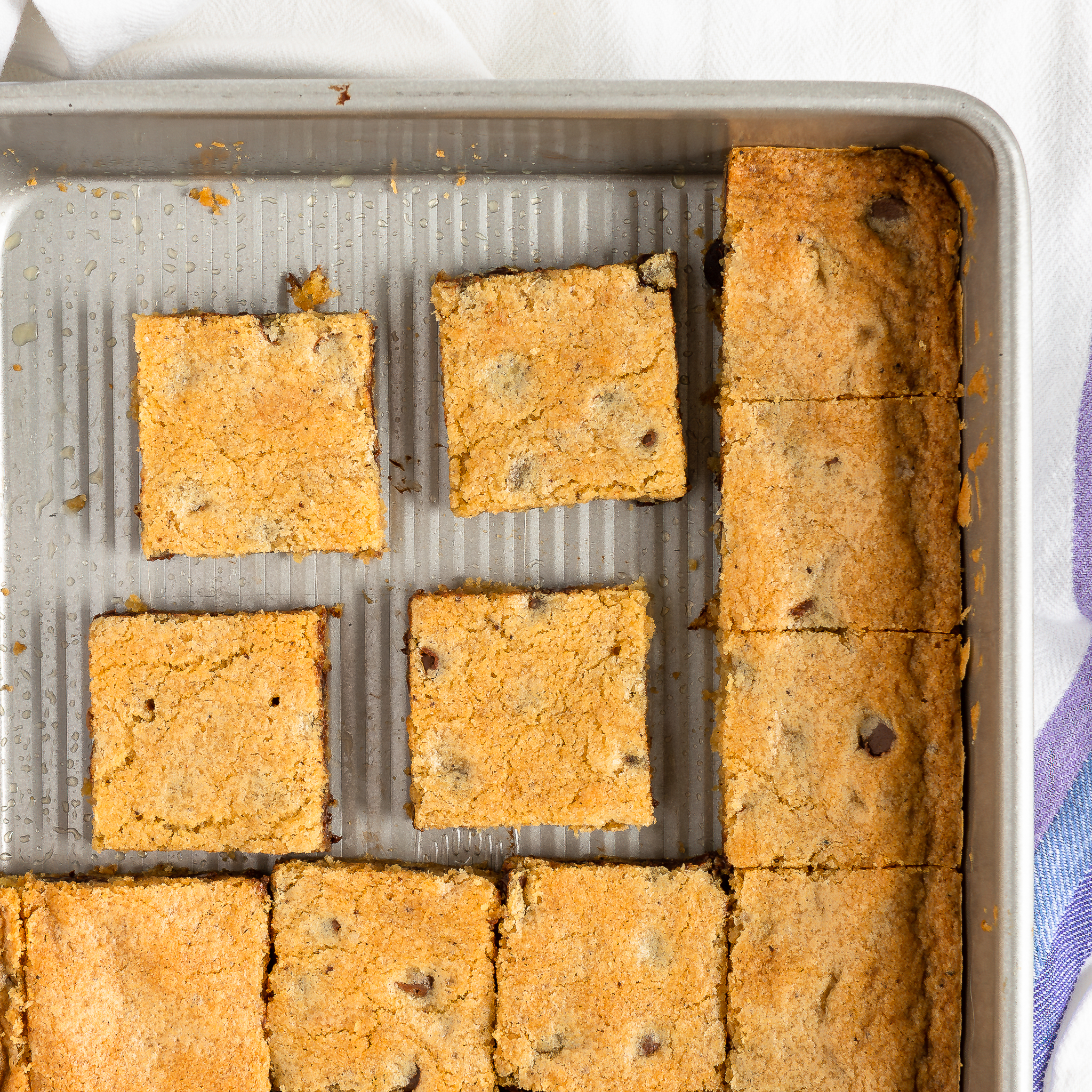 overhead view of chocolate chip cookie bars in baking pan