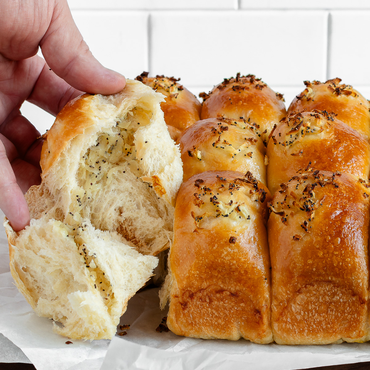 Opened onion roll showing the onions inside the roll.